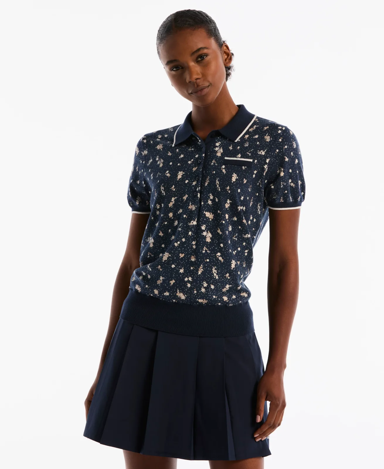 Woman wearing the Original Penguin Floral Pocket Golf Sweater Polo in Black Iris